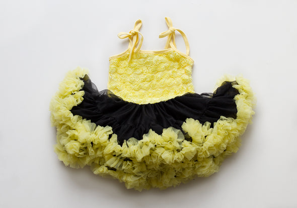 Rosy frilly pettidress black skirt with yellow trim