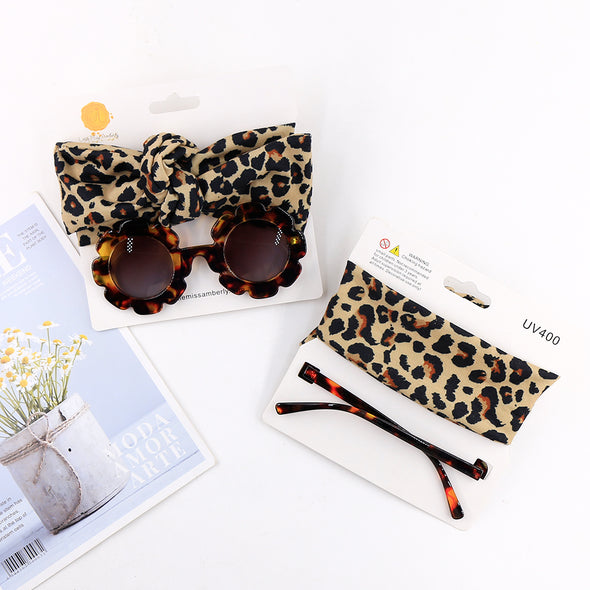 Leopard headwrap and sunglasses